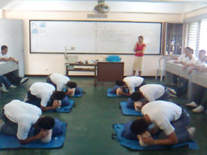 Cadets performing CPR in a classroom as part of their training.