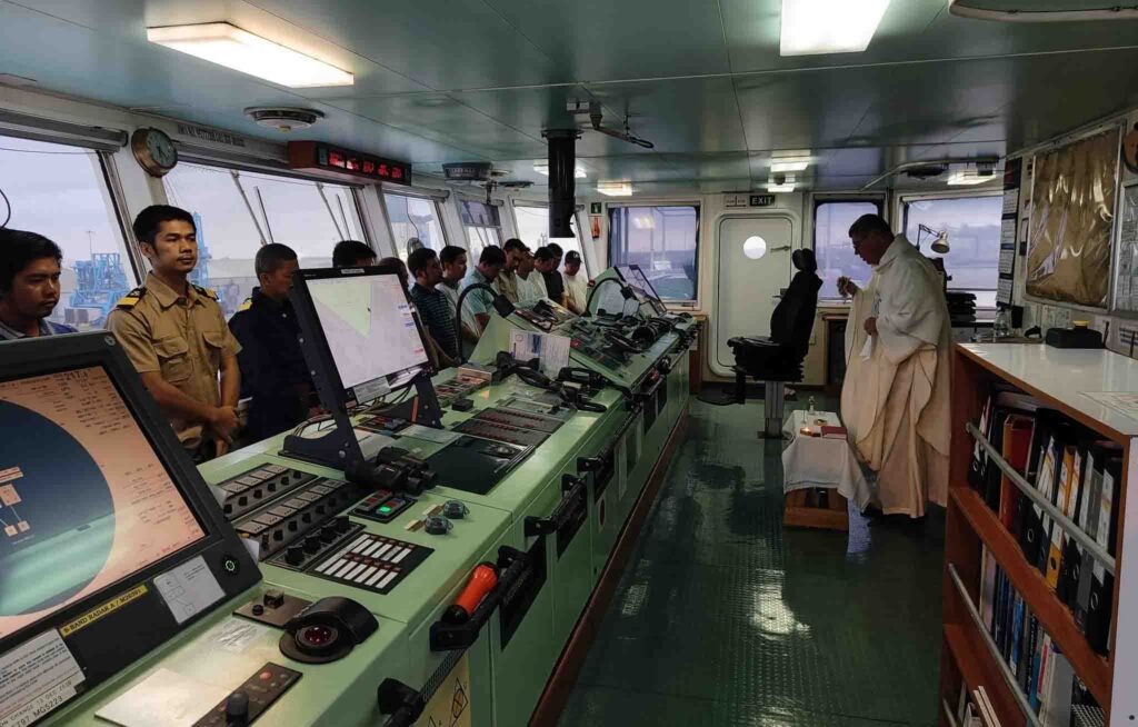 A Mass held inside the bridge of the ship with the crew attending.