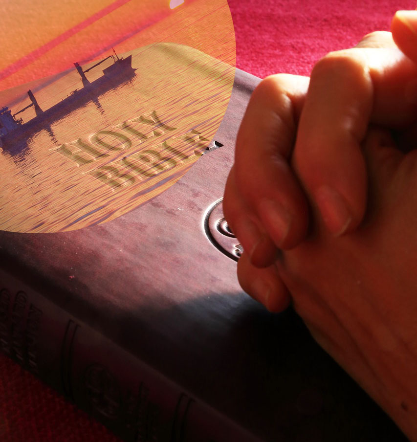 Praying with your hand on the Holy Bible.