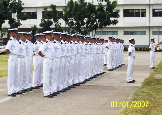 Maritime cadets in parade rest formation.