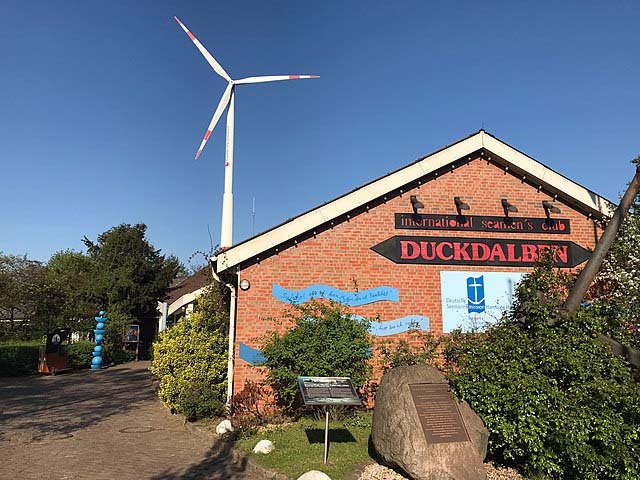 The Duckdalben Seaman's Club in Hamburg under a sunny clear sky.