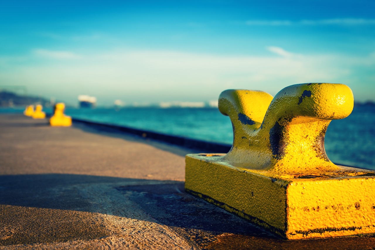 Yellow bollards on the pier.