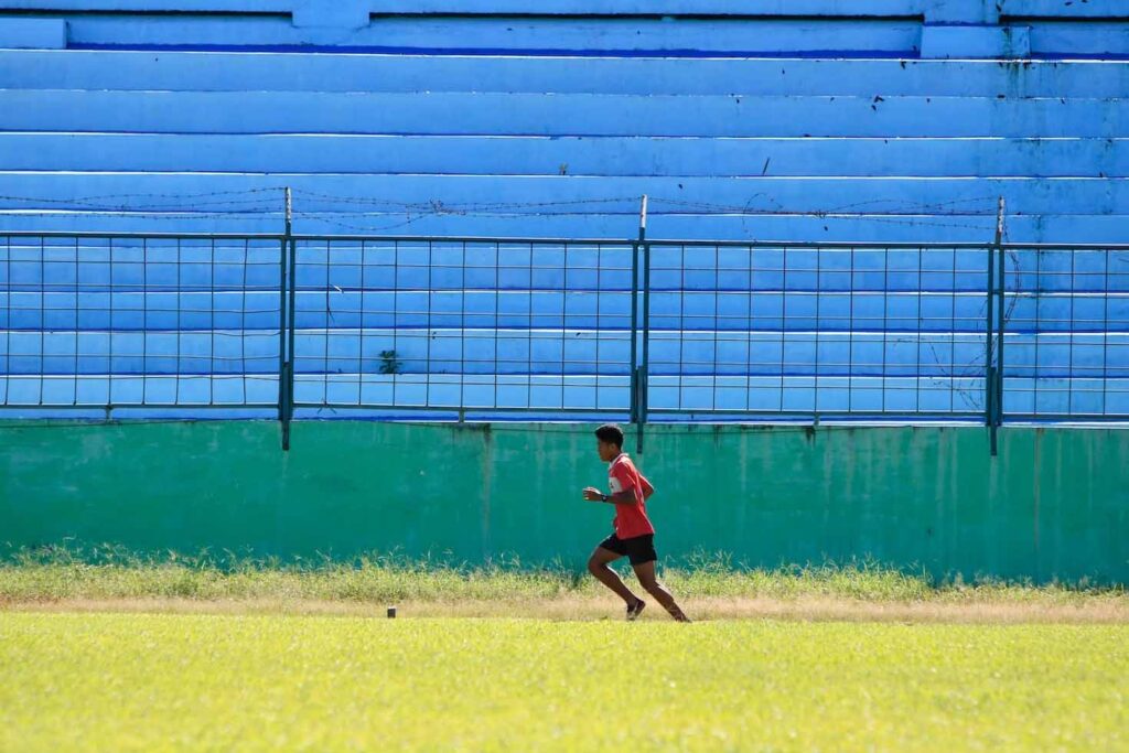 A man jogging on the field.