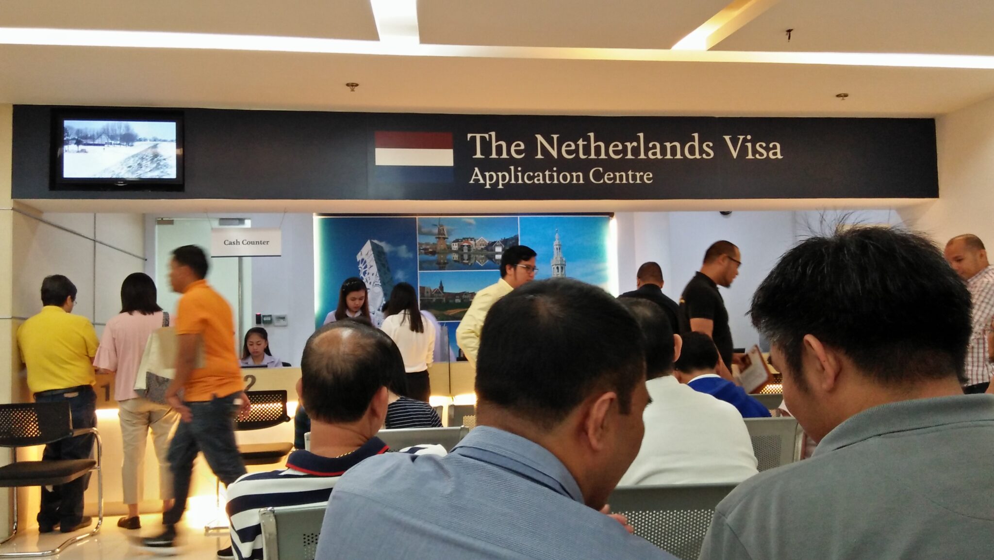Applicants in the waiting line of visa application center inside VFS Global.