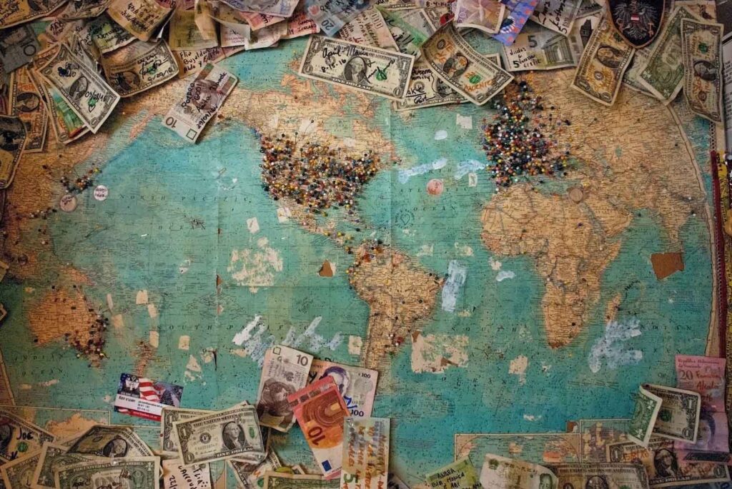 An old map with money surrounding it.