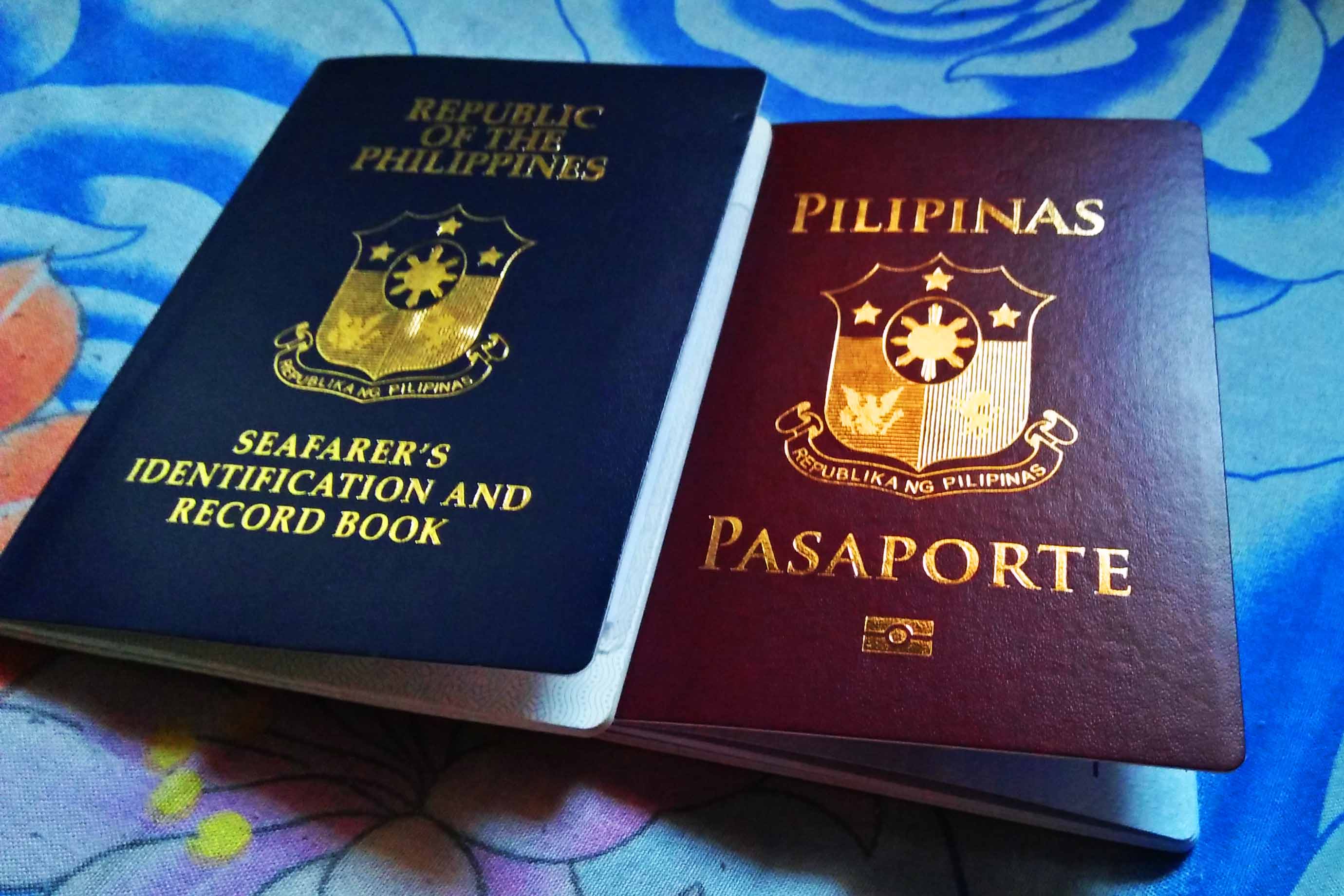 Passport and Seaman's Book placed side by side as valid IDs