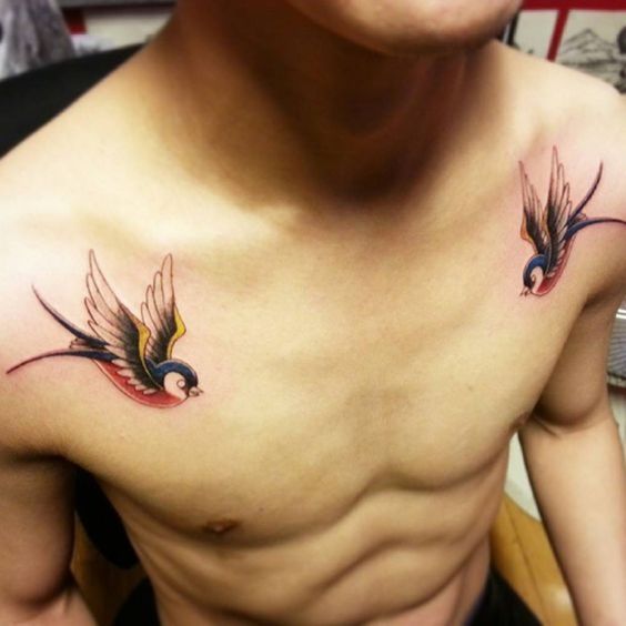 A colored swallow Tattoo on each side of the chest of a sailor.