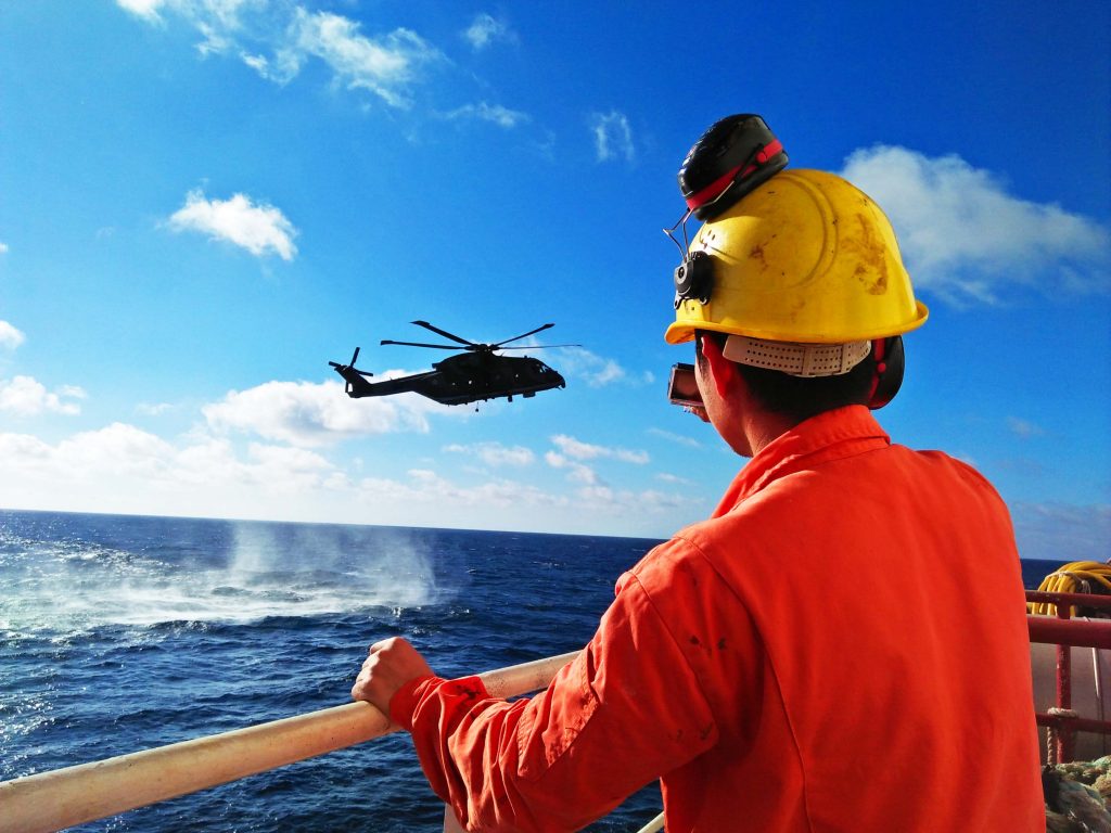 Search and rescue navy vessel hovering close to the waters during a SAR exercise with our ship.