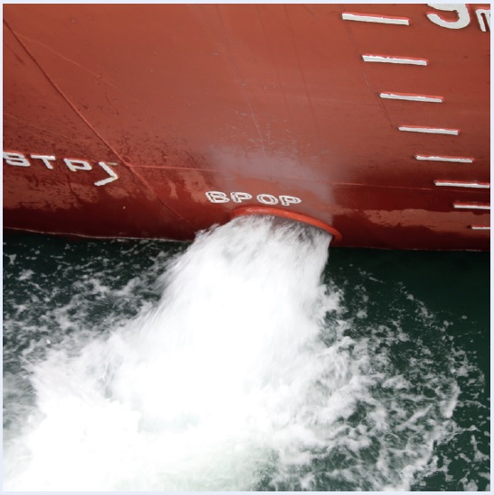 Ballast water coming out of the ship's side.