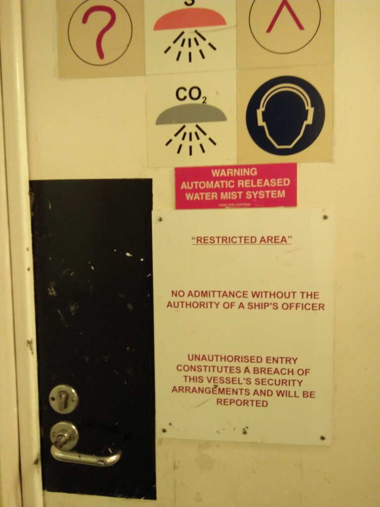 Door marked with "Restricted Area". This is in accordance with ISPS Code.