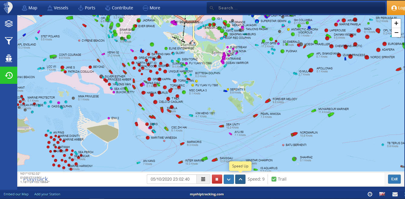 MyShipTracking playback with aerial view of ships' tracks, the ships in colors of red and green, as well as shore features.