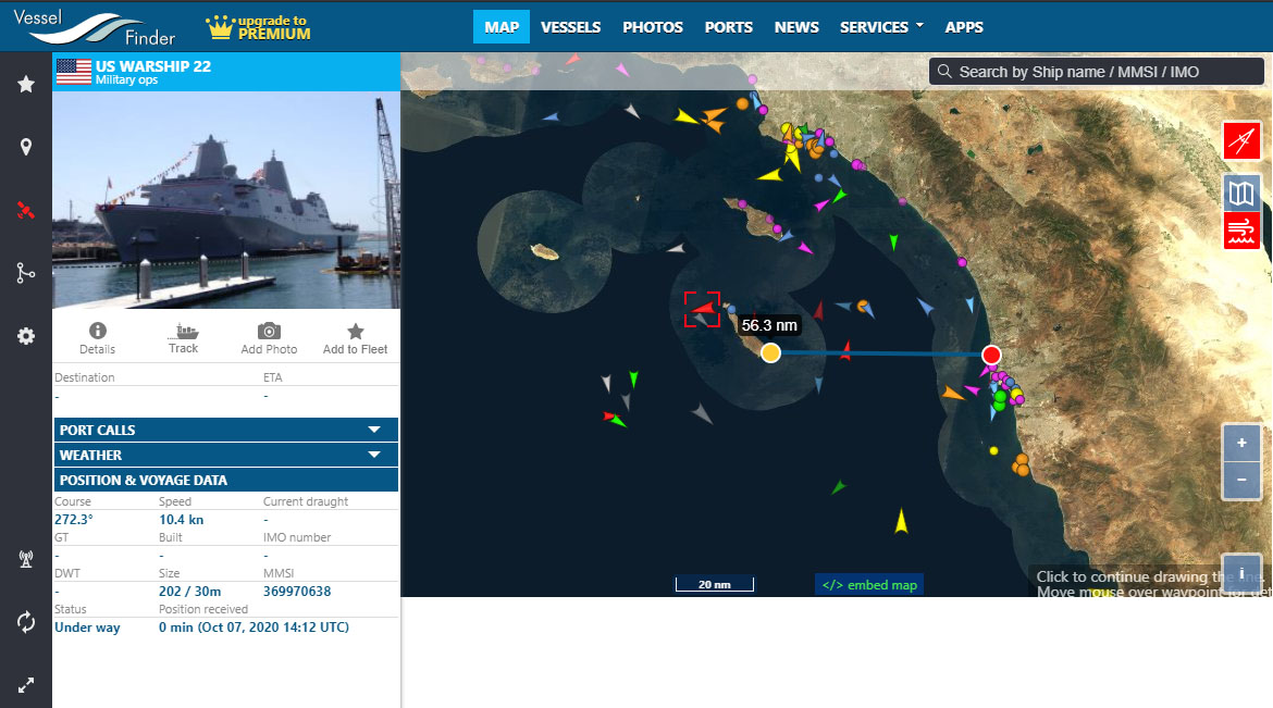 Tracking a warship with Vessel Finder while measuring distance its the shore as well as showing different types of vessels with different colors of red, green, yellow, and light blue.