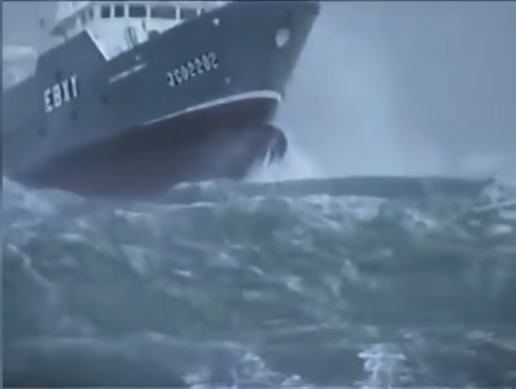 Fishing boat thrown into the air by a huge wave after getting caught in a storm.