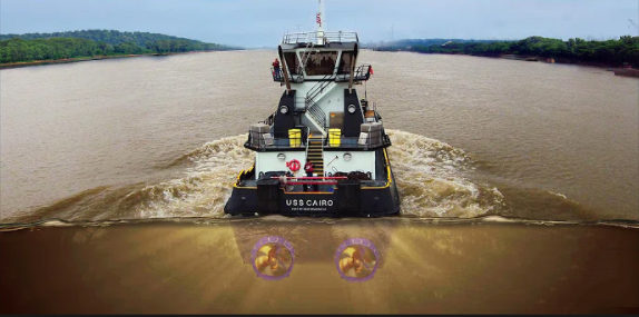 A tugboat fitted with Z-drives navigates through the river.
