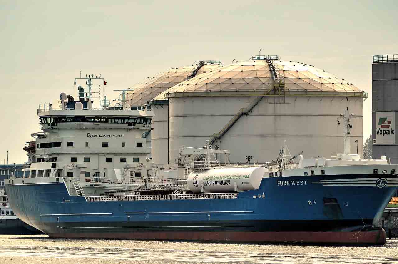 Fure West - a General Purpose Chemical/ Product Tanker Ship having a blue hull, white deck, and white accommodation berthed alongside a terminal.