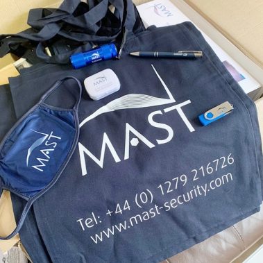 MAST Security Uniforms and Kit with facemask, ball pen, and USB thumb drive.