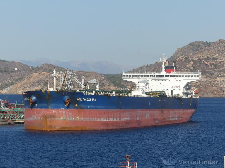 Crude Carrier Miltiadis M II docked in a port and performing cargo operation.