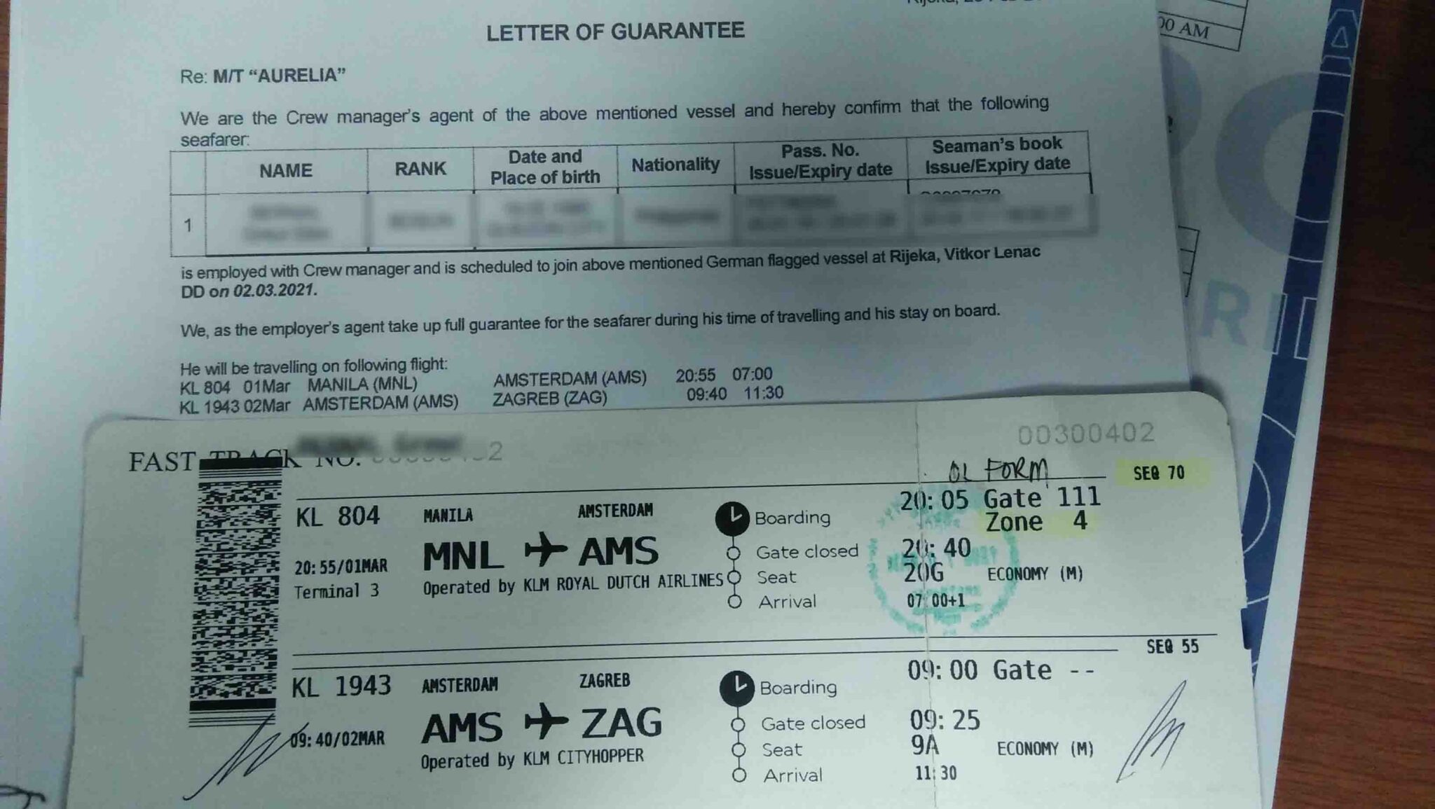 Letter of Guarantee and boarding pass.
