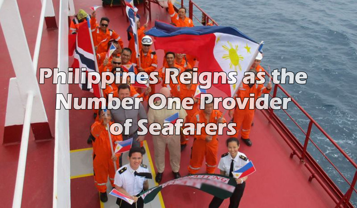 Seafarers out on deck waving the Philippine Flag.
