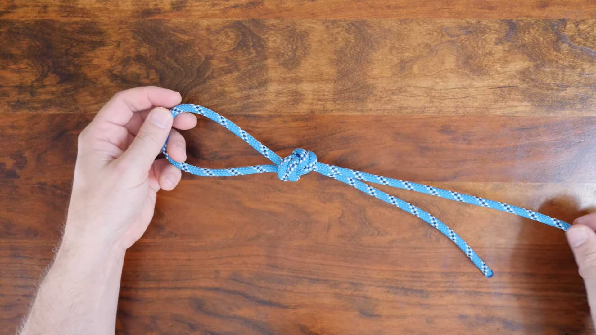 An Overhand Loop using a blue rope.