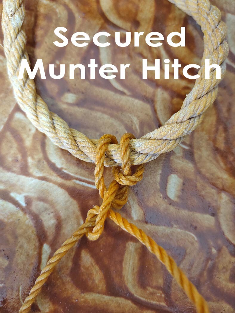 Secured Munter Hitch tied to a bigger rope.