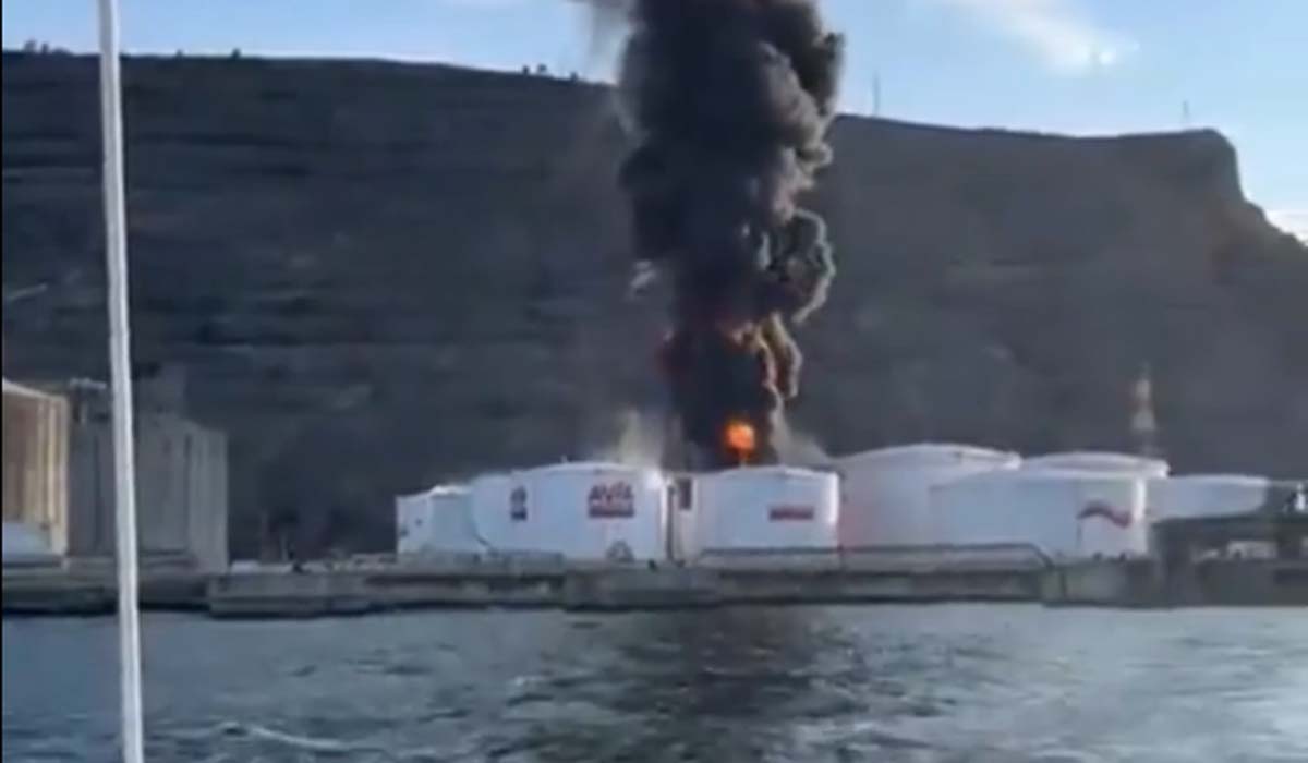 Fire in an oil tanker terminal in Bilbao, Spain with smoke coming out of the burning tanks.