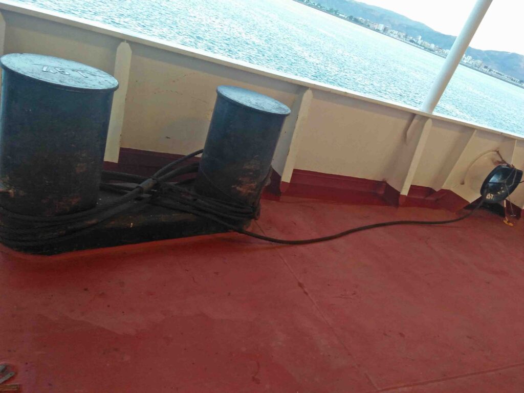 Fire wires on aft starboard with one end secured to the bollard and the other end is deployed.