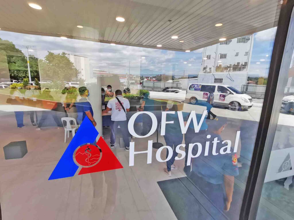 Looking at the patients and people through the glass of OFW Hospital.