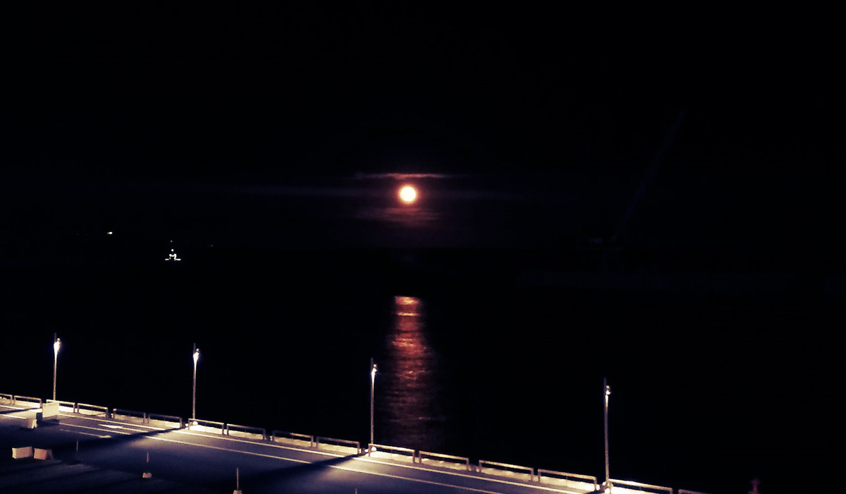 Blood moon on the shores of Ponta Delgada, Spain.