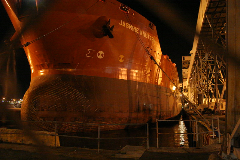 Shuttle tanker Jasmine Knutsen moored in a port using wire ropes with rope tails