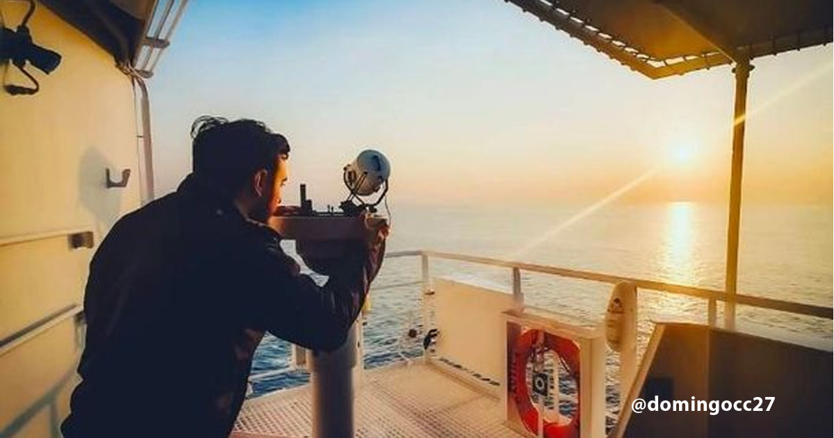 Chief Officer Domingo Antonio Cargiulo using the gyro repeater to take the bearing of the sun.