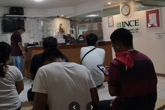 Seafarers and OFWs sitting in the Waiting Area of JNCE Diagnostics.