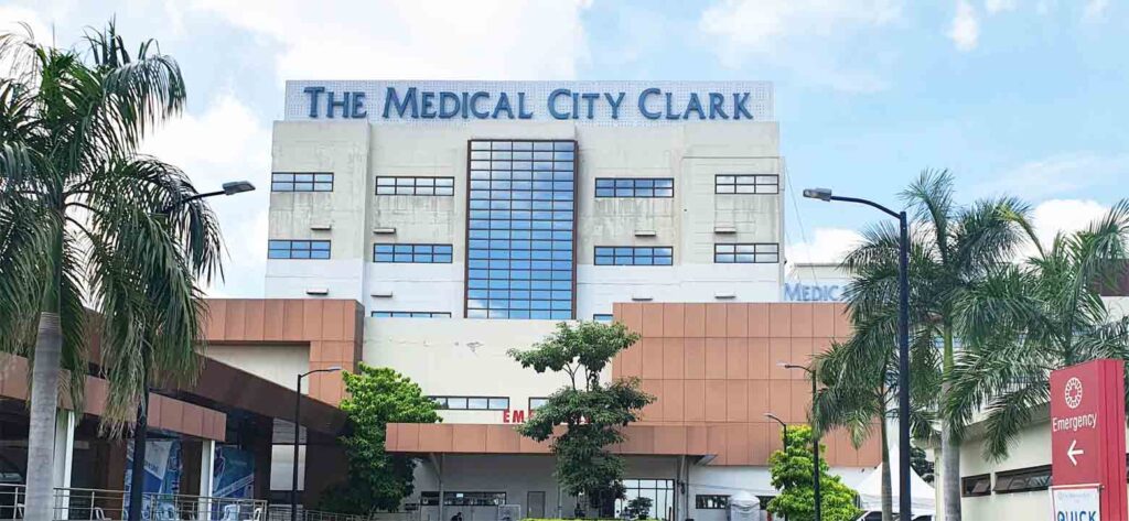The Medical City Clark building viewed from the front on a sunny day.