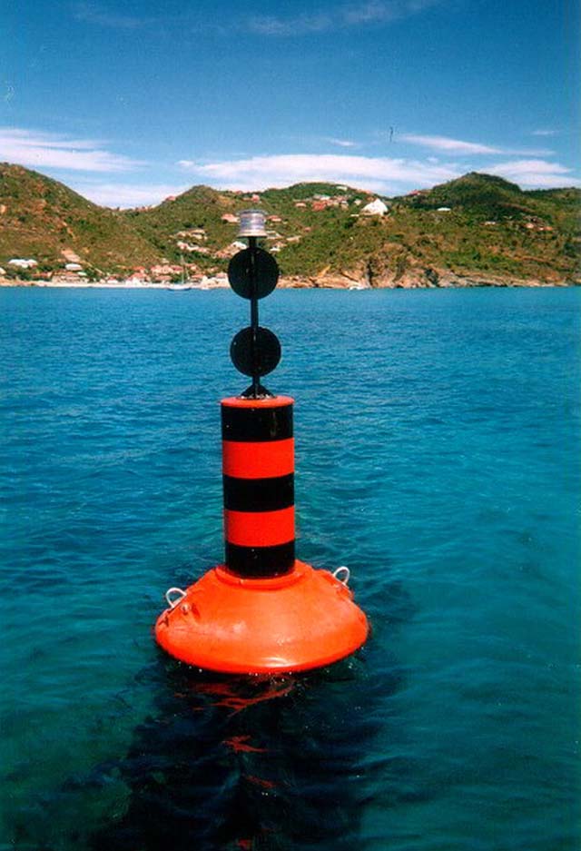 An isolated Danger Mark having a color of black and red bands with two black balls on its top marks.