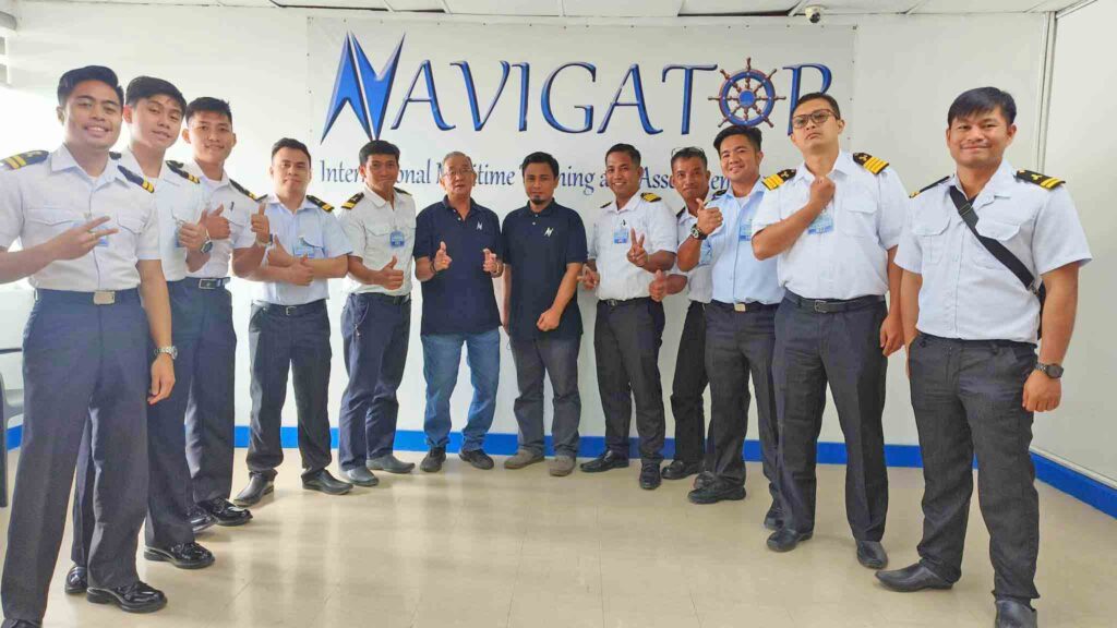 Seafarers with their uniforms on a photo ops in Navigator Maritime Training and Assessment Center.