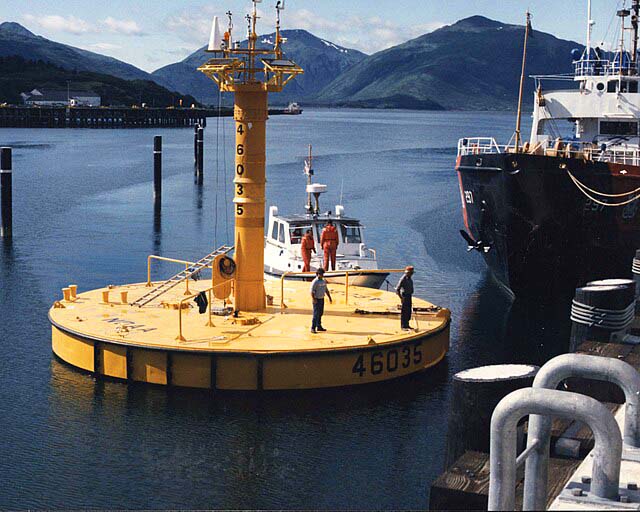 A research buoy colored yellow with various instruments installed.