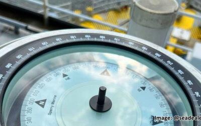 How Does a Magnetic Compass Work on Metal Ships?